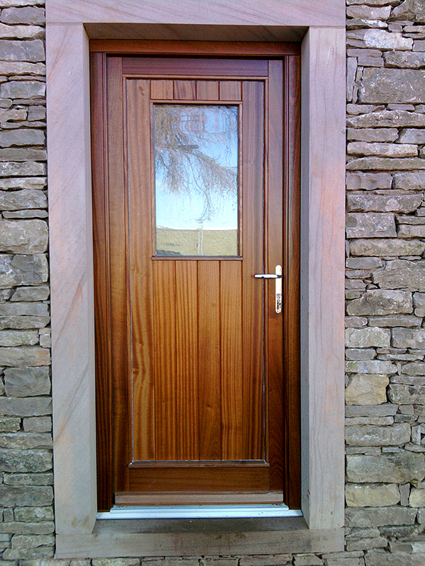 single wooden door with window from A J 7 D Chapelhow Ltd