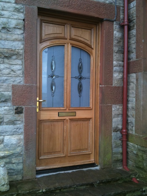 Oak single door with decorative panels from A J 7 D Chapelhow