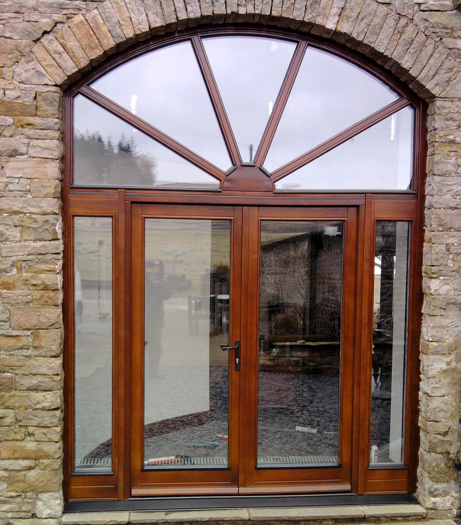 Sunburst glass and wood double door from A J & D Chapelhow (Cliburn) Ltd